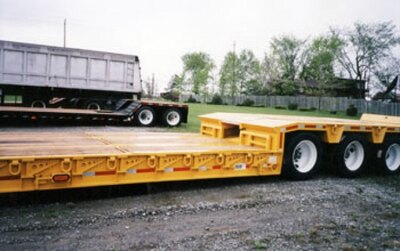 J.C. Hydraulic detachable gooseneck float c/w retractable ramps to rear bridge designed for paving contractors