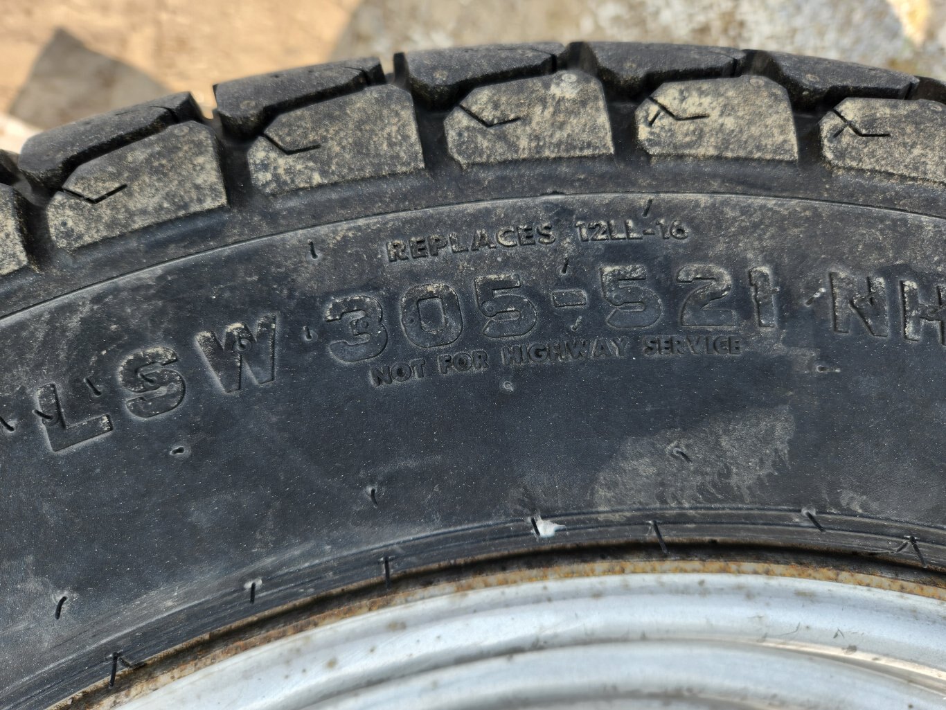 Titan LSW305 521 R3 turf tires on rims