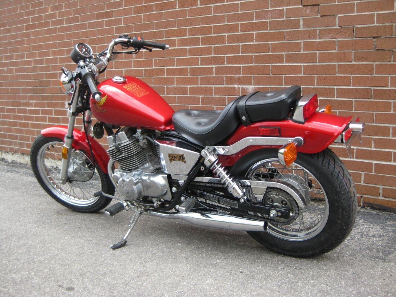 1985 CMX250C Rebel Honda  SOLD AND CONGRATULATIONS TO MIZZZ JAZZZ WITH PIZZAZZ “THE WIND SISTER ! WELCOME TO THE COMMUNITY OF THE HONDA RETRO RED REBEL CMX250 – CRUISER STYLE DA WILD THANG RIDIN “CUTTIN” CITY GRID OR “CARVIN THE CANYONS” TO THE FREEDOM ZONE WITH THANKS FROM GARY & TEAM CYCLE WORLD!!!!