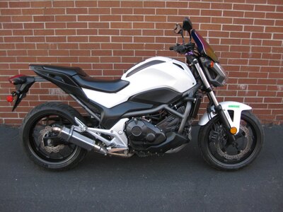 2013 HONDA NCX 700 SA - CONGRATULATIONS SIR AHMAD - THE ROAD WARRIOR - ON THE ADOPTION OF THE HONDA NCX700SA- THE ULTIMATE STREET  FIGHTER - THE WHITE LIGHTNING - COMBINES POWER, PERFORMANCE & COMFORT - EITHER CUTTIN CITY GRID OR CARVIN CANYONS YOU WILL ARRIVE IN STYLE - CONGRATS FROM GARY & TEAM CYCLE WORLD !!!!