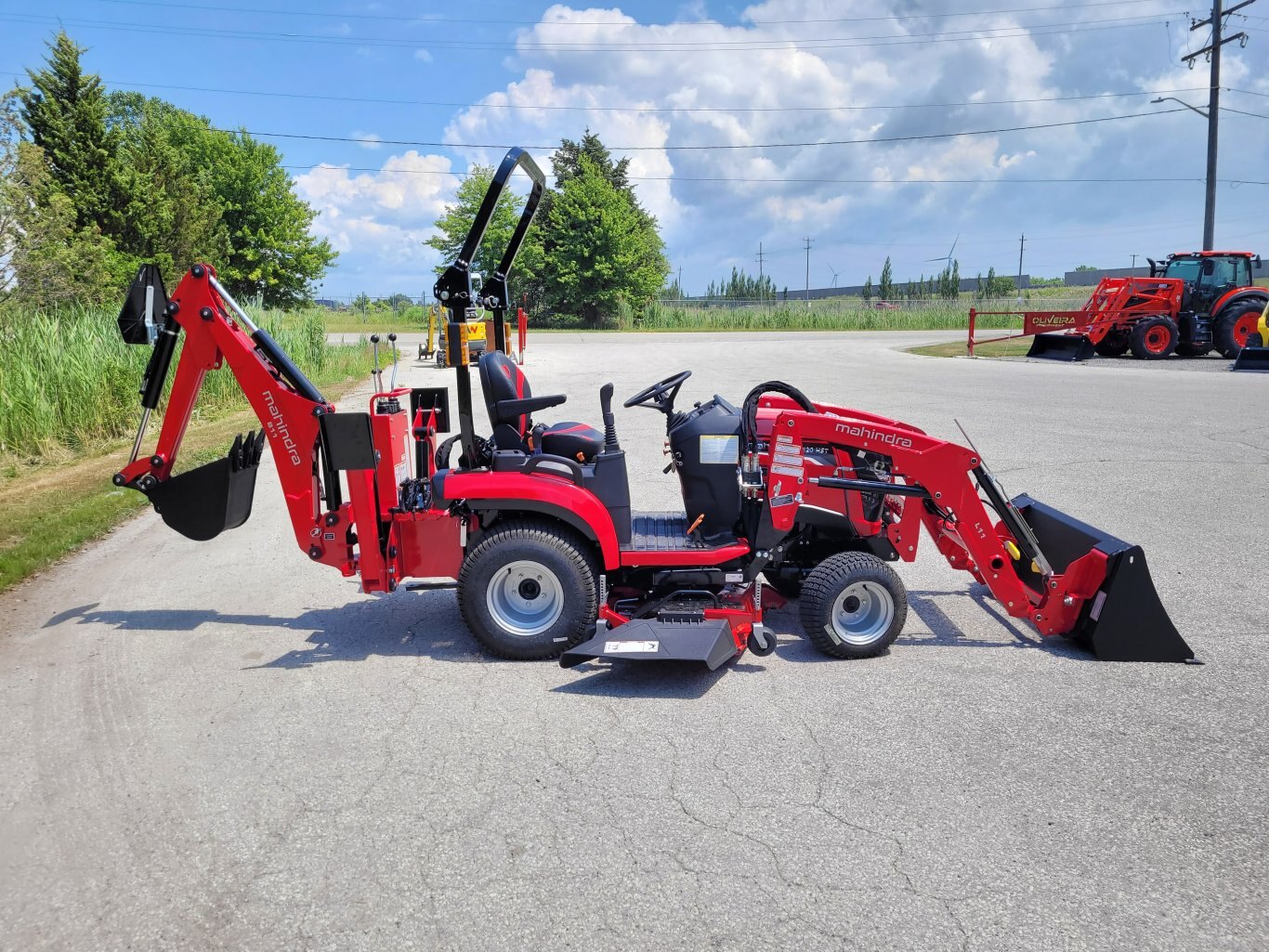 2025 Mahindra 1120 HST 20hp w/Loader, Backhoe, Mower Deck