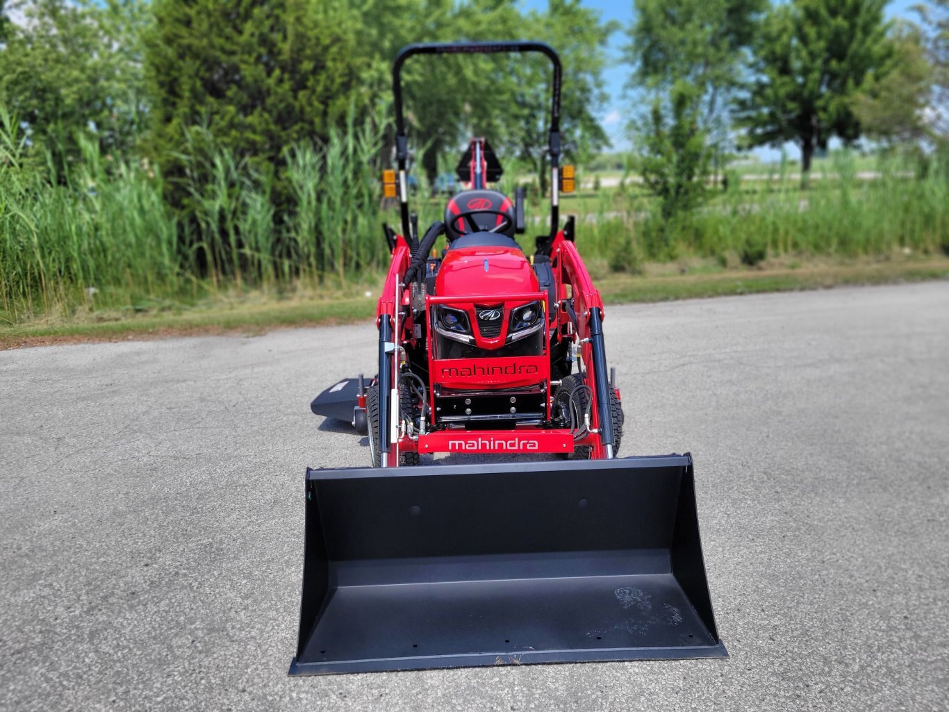 2025 Mahindra 1120 HST 20hp w/Loader, Backhoe, Mower Deck