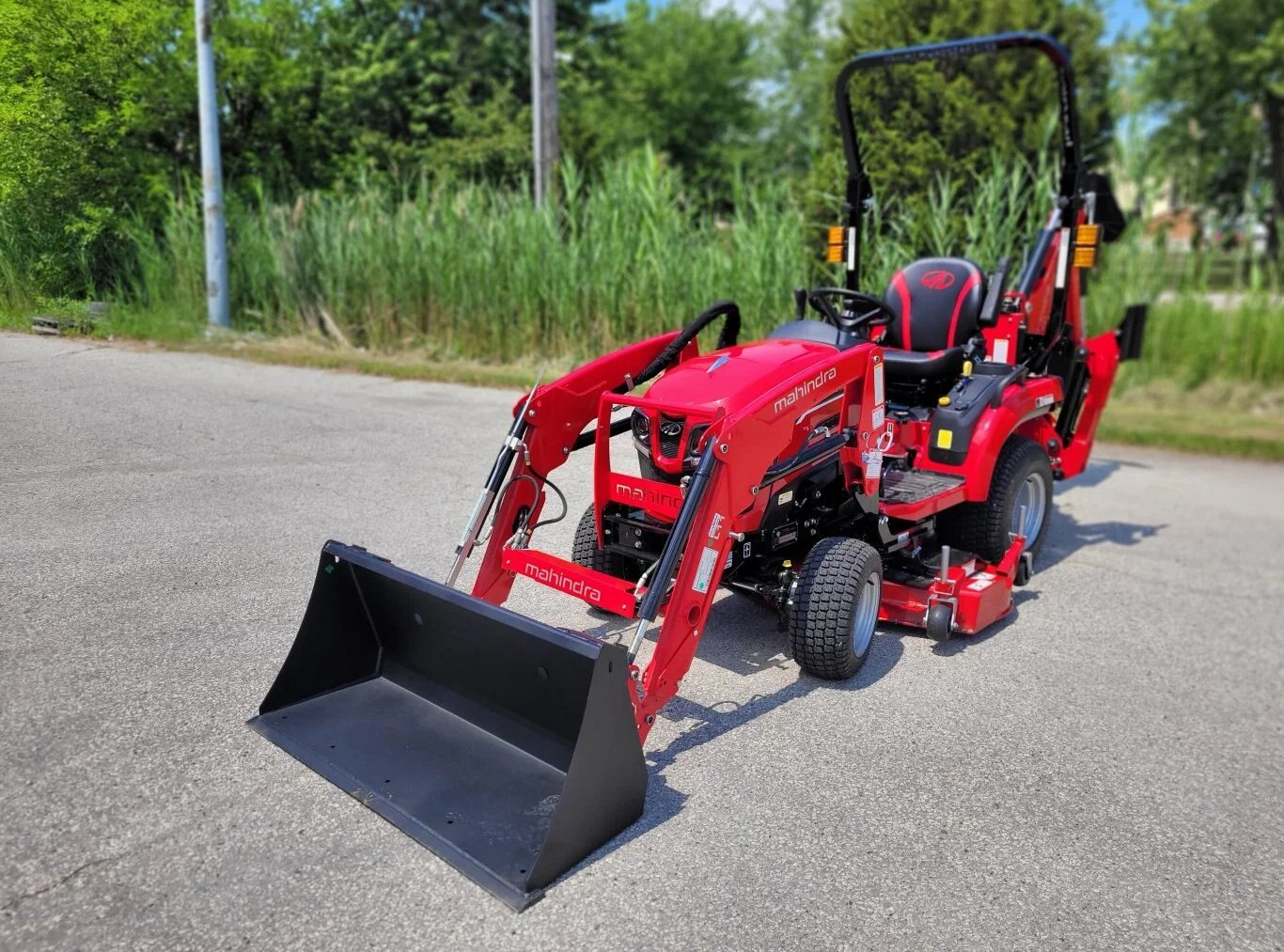 2026 Mahindra 1120 HST with Loader, Backhoe, Mower